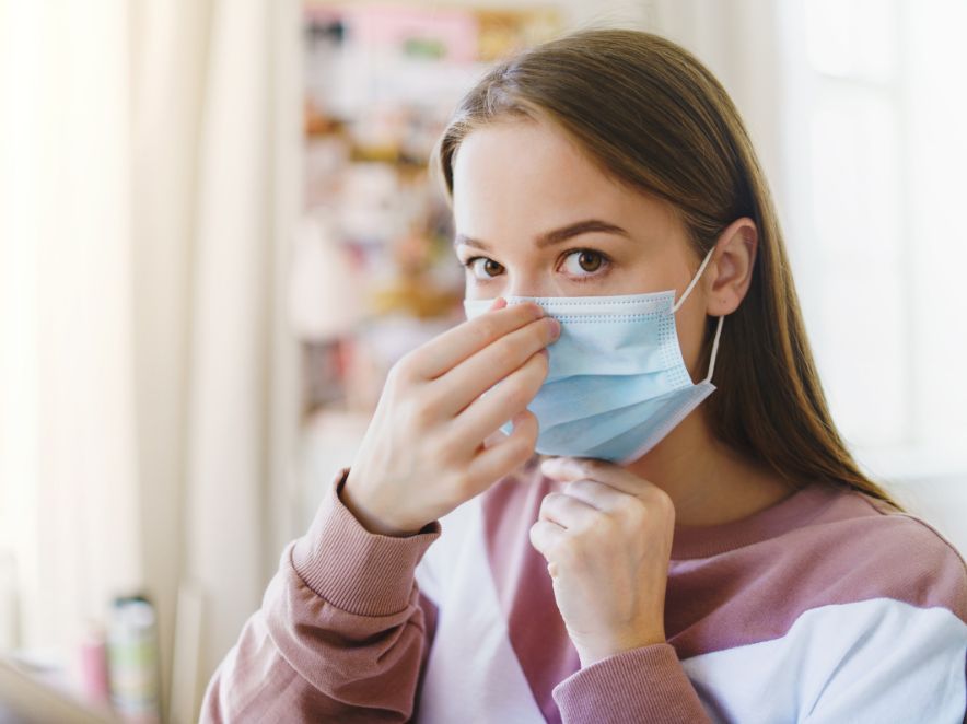 Patient wearing a face mask at home Patient wearing a face mask at home