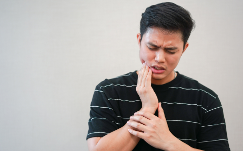 in tooth pain man sensitive tooth Malborne